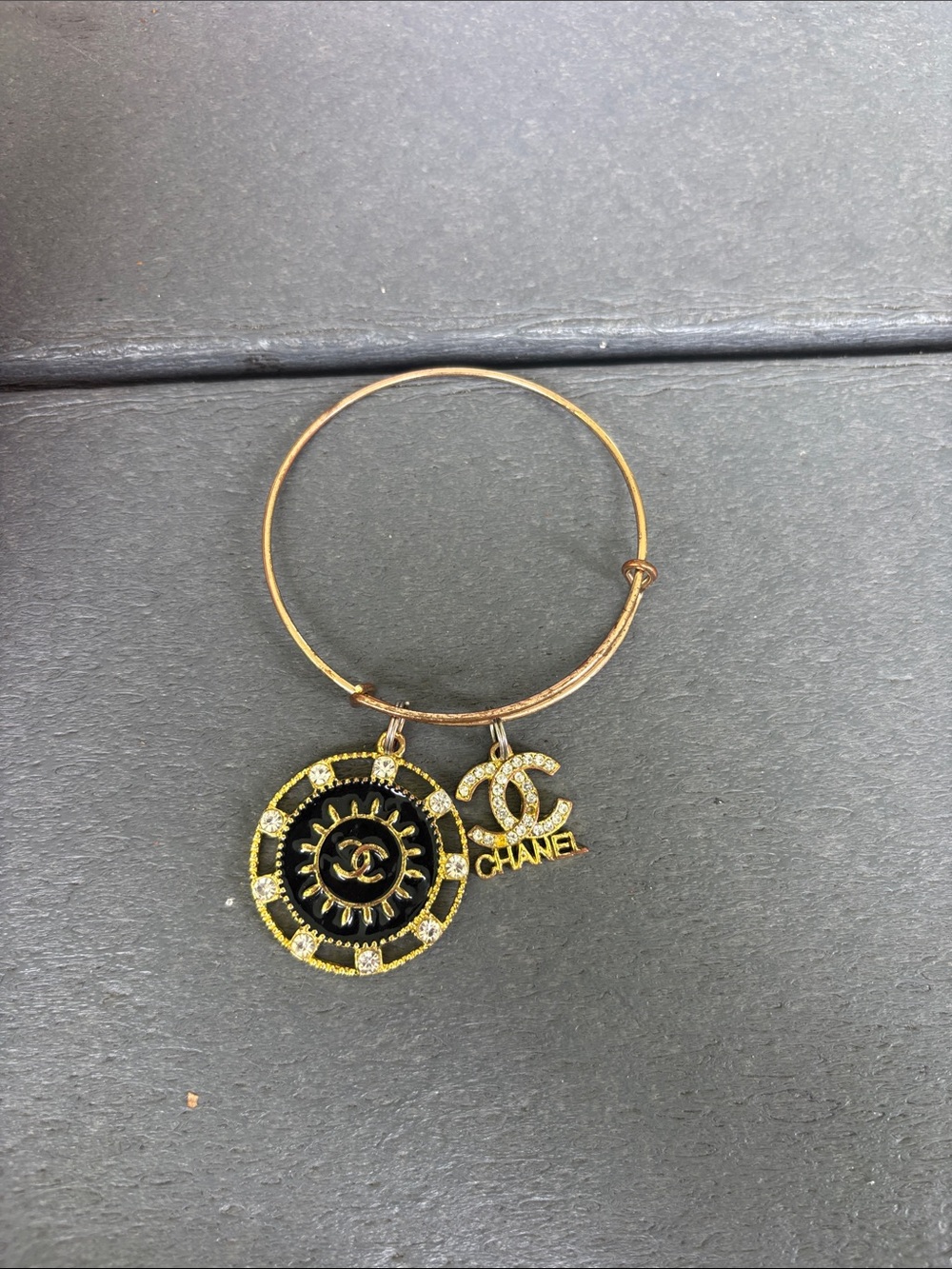 CHANEL Gold and Black Charm Bangle Bracelet